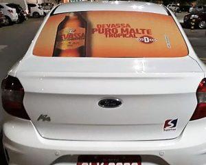 propaganda Cerveja Devassa nos taxidoor na cidade de Maceió
